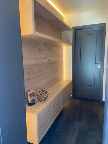 a room with a wooden shelf and a door at Hotel Koch in Bad Liebenzell