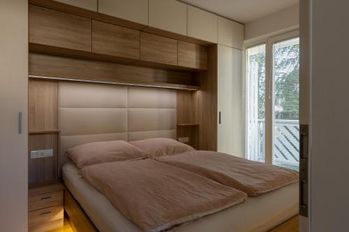 Llit o llits en una habitació de Bled4U Apartment