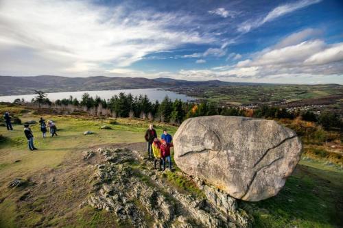 people standing on top of a lush green hillside at East Coast Adventure Centre Glamping in Rostrevor