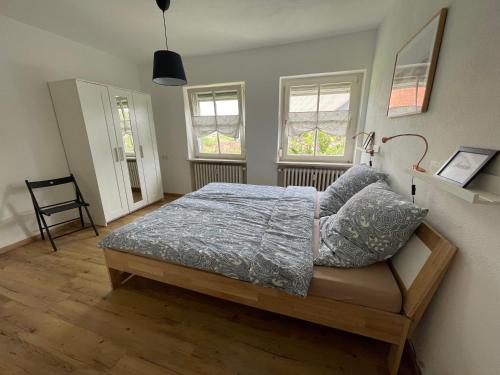 En eller flere senge i et værelse på Ferienwohnung Wässerndorf