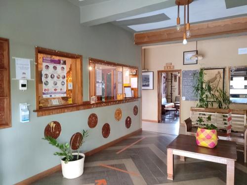 a lobby of a store with a bench and a table at HOTEL IVATO , Airport in Antananarivo