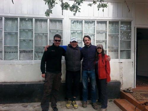 a group of people standing in front of a building at Guest House KAGAN in Toktogul