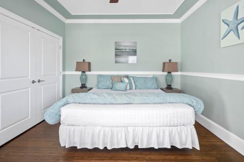 a bedroom with a bed with blue and white at The Beacon Waterfront Inn in Hull