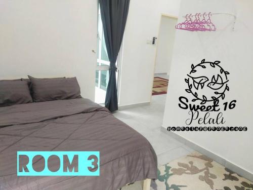 a bedroom with a bed and a sign that reads roof sweet ball at Sweet 16 Pelali Homestay Pengerang (Wifi/Netflix) in Pengerang
