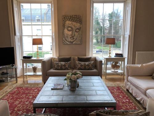a living room with a couch and a coffee table at 1 Georges Place Bath in Bath