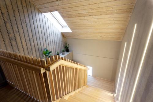 a hallway with wood paneling and a skylight at Ķestermuiža in Alūksne