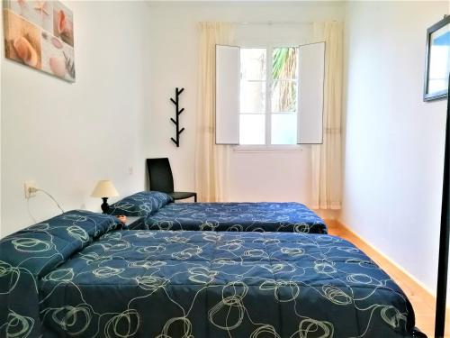 Giường trong phòng chung tại Casa rural Don Armando