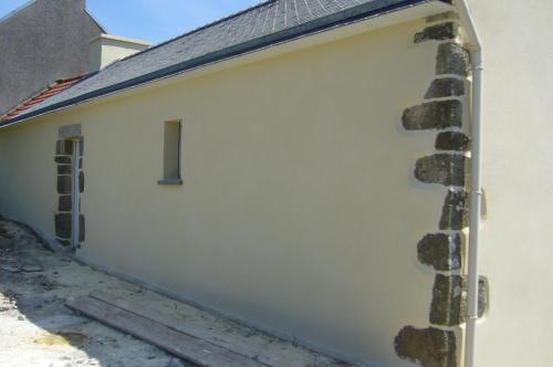 a white garage door with a number on it at An ti koz in Plouguerneau