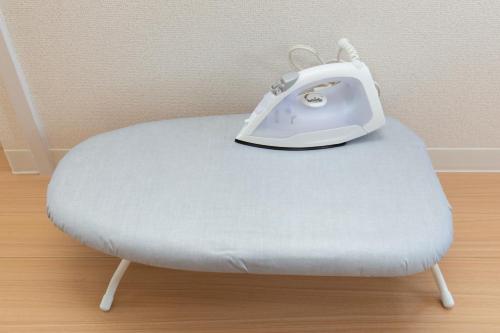a white toaster sitting on top of a chair at 唐沢ホテル Karasawa-Hotel in Tokyo