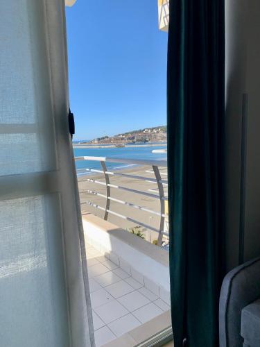 a view of the beach from a window at Eri Apartments 4 in Shëngjin