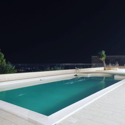 a swimming pool at night with the sky at Agriturismo Santa Barbara in Prignano Cilento