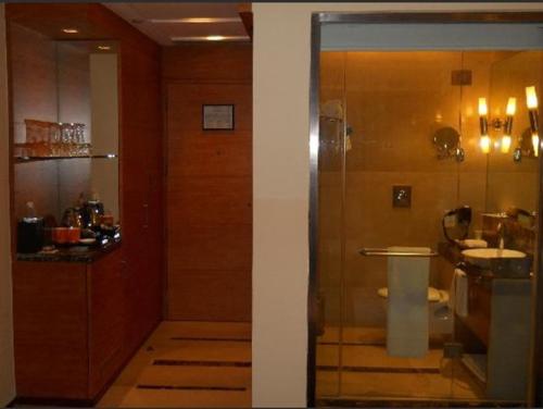 a bathroom with a shower and a sink at Radisson Blu Marina Hotel Connaught Place in New Delhi