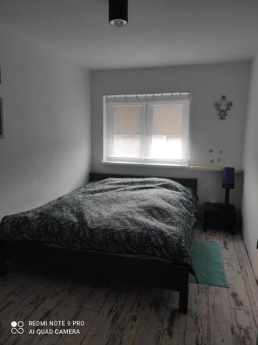 Ένα ή περισσότερα κρεβάτια σε δωμάτιο στο Apartament u Bena