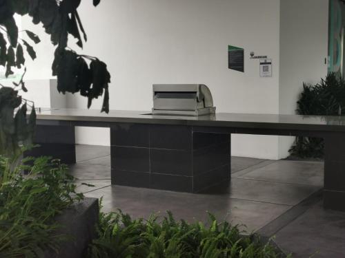 a fax machine sitting on a desk in a building at Continew Residence by HomeBrickz in Kuala Lumpur