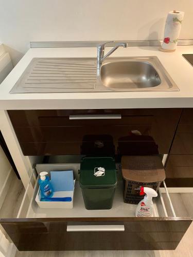 a kitchen drawer with a sink and some boxes at LA PIAZZETTA in Comacchio