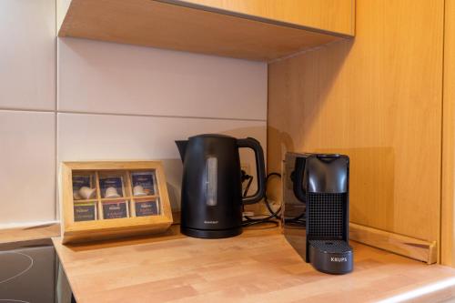 a coffee maker sitting on top of a kitchen counter at ☆ Modern stylish flat in central location in Wilhelmshaven