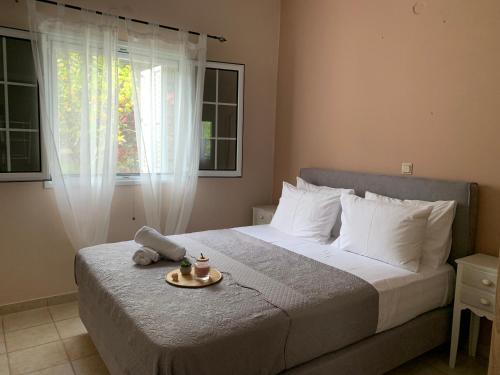 Ένα ή περισσότερα κρεβάτια σε δωμάτιο στο EY House