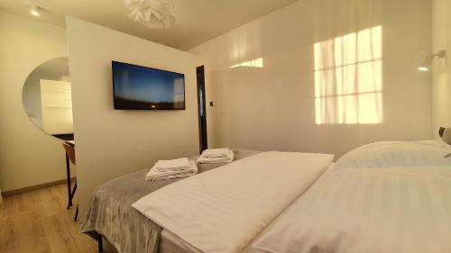Ferrata Apartamenty Zakopaneにあるベッド