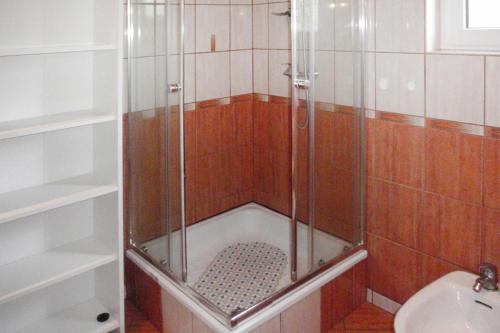 a shower with a glass door in a bathroom at holiday home, Kolczewo in Kołczewo