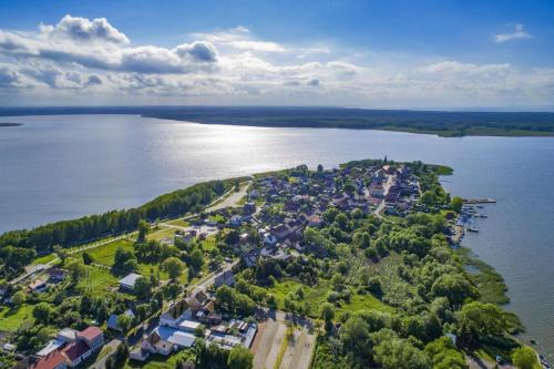 an aerial view of a small island in the water at Holiday home for 10 Person in Nowe Warpno in Nowe Warpno