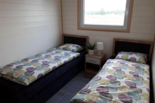 A bed or beds in a room at holiday home, Jezierzany