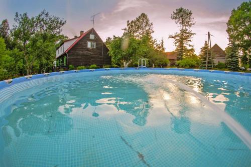 Gallery image of Holiday home in the forest, private garden, sauna in Powidz