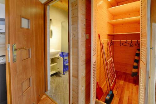 a small room with a closet and a staircase at Cottage in Jaros awiec near Seaside Beach in Jarosławiec