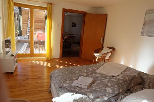 a bedroom with a bed with two books on it at Am Jenbach in Bad Feilnbach