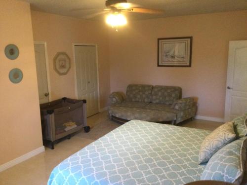 a living room with a bed and a couch at Mountain View retreat st.Elizabeth in Far Enough