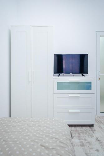 Μια τηλεόραση ή/και κέντρο ψυχαγωγίας στο Apartament Central Salvo