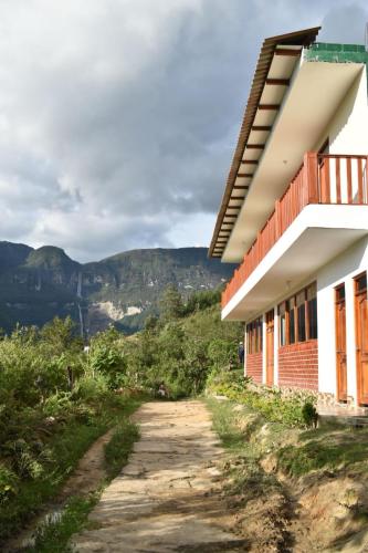a building on the side of a dirt road at La Rivera de Gocta in Cocachimba