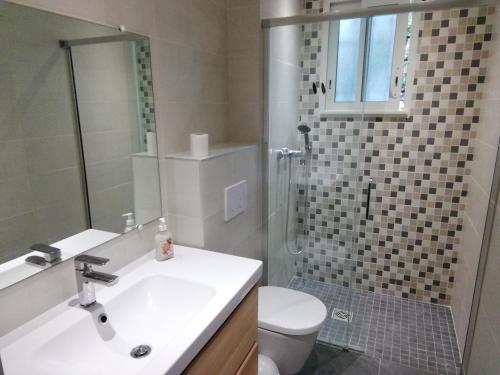 a bathroom with a sink and a toilet and a shower at LA CASA in Cagnes-sur-Mer