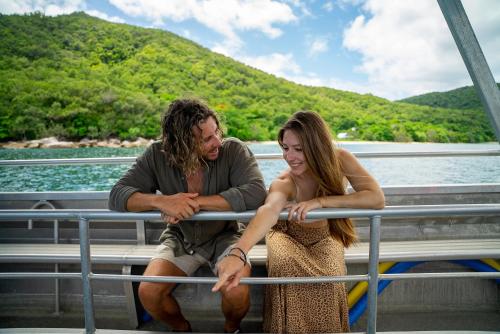 a man and a woman sitting on a boat at Fitzroy Island Resort in Fitzroy Island