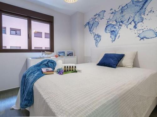 a bedroom with a large bed with a map on the wall at Apartment, Malaga in Málaga