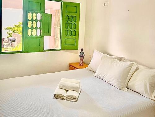 
A bed or beds in a room at Casa Frente Mar Japaratinga
