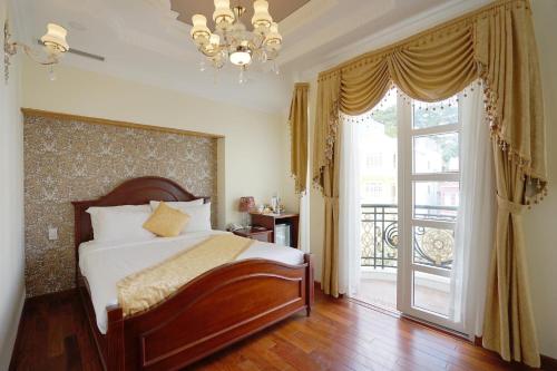 Ένα ή περισσότερα κρεβάτια σε δωμάτιο στο Dream Luxury Hotel