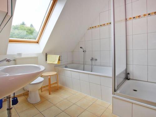 a bathroom with a sink toilet and a bath tub at Holiday resort in the Müritz National Park, Mirow in Mirow