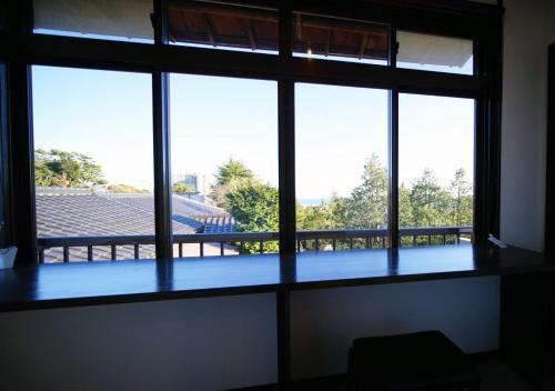 a large window with a view of a stadium at ATAMI SPRING TERRACE HOTEL in Atami