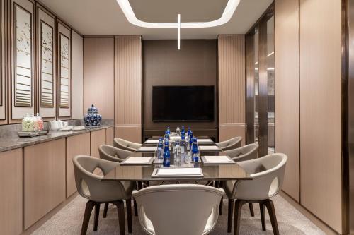 a conference room with a long table and chairs at Address Istanbul in Istanbul