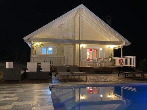 a house with a swimming pool at night at Quinta de Argos in Cehegín