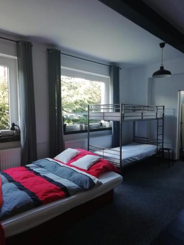 a bedroom with a bunk bed and a window at Apartament Pod Kukułką in Kłodzko