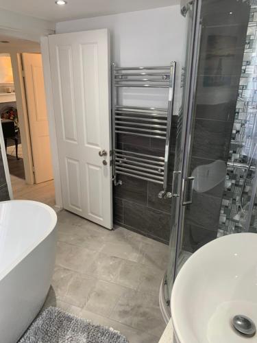 a bathroom with a shower and a toilet and a sink at Hexham Town Centre, Market Place View in Hexham