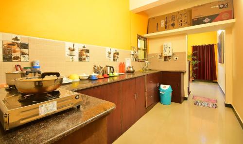 a kitchen with a counter with a bowl on a stove at Villa Freddy Individual 2 BHK Properties at Second Floor with Modern Amenities in Puducherry