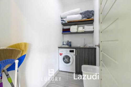 a laundry room with a washer and dryer at New Modern 3 Bedroom Pool Villa MS24 in Hua Hin