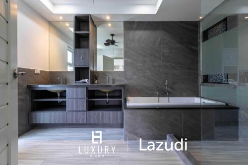 a bathroom with a tub and a sink at New Modern 3 Bedroom Pool Villa MS24 in Hua Hin