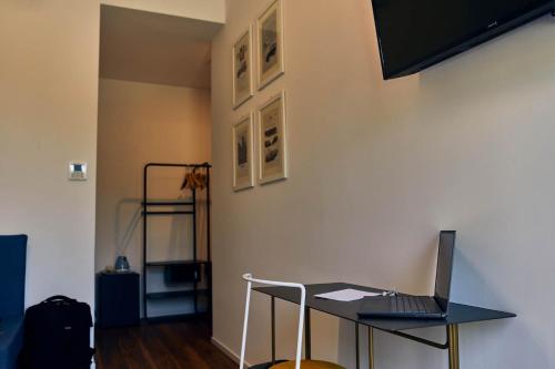 a laptop sitting on a desk in a room at Hotel Paradiso Conca d'Oro in Nago-Torbole