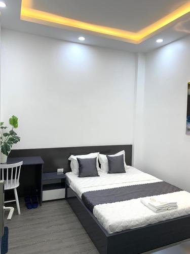 Postel nebo postele na pokoji v ubytování Royal Hotel Ninh Thuận