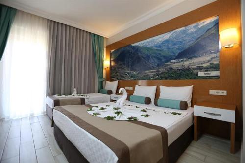 Un pat sau paturi într-o cameră la Anita Dream Hotel