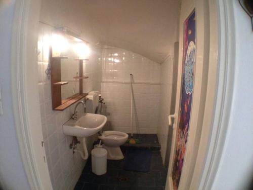 a bathroom with a sink and a toilet at Studio 10 minutes from the center of Heraklion. in Heraklio