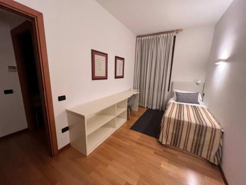 Ένα ή περισσότερα κρεβάτια σε δωμάτιο στο Palazzo Brando - Living Apartments